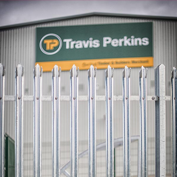 Palisade fencing in front of Travis Perkins building