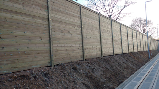 Close-up of solid timber acoustic fence boards