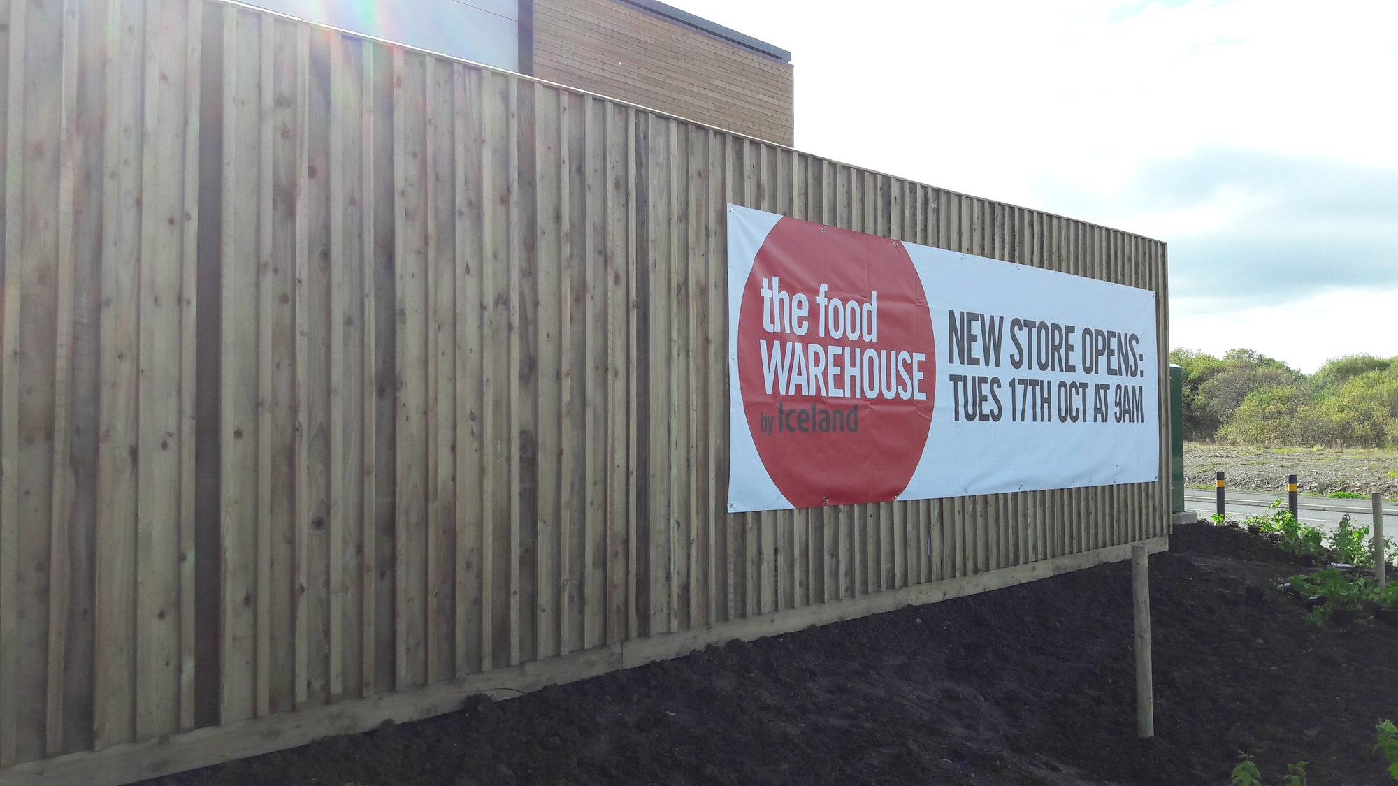 Bespoke timber acoustic fence design installed in a commercial premises