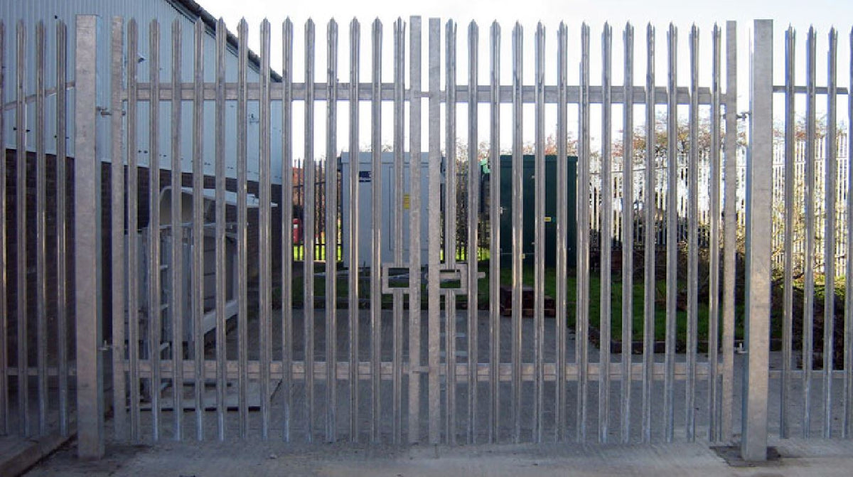 Close-up of galvanized steel palisade gate with square hollow section (SHS) steel hanging posts, adjustable hinges, drop bolts, and slide latches.