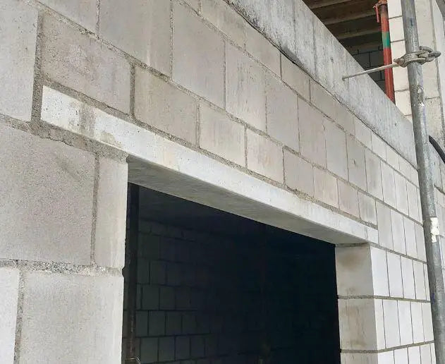 Prestressed concrete lintel installed over doorway