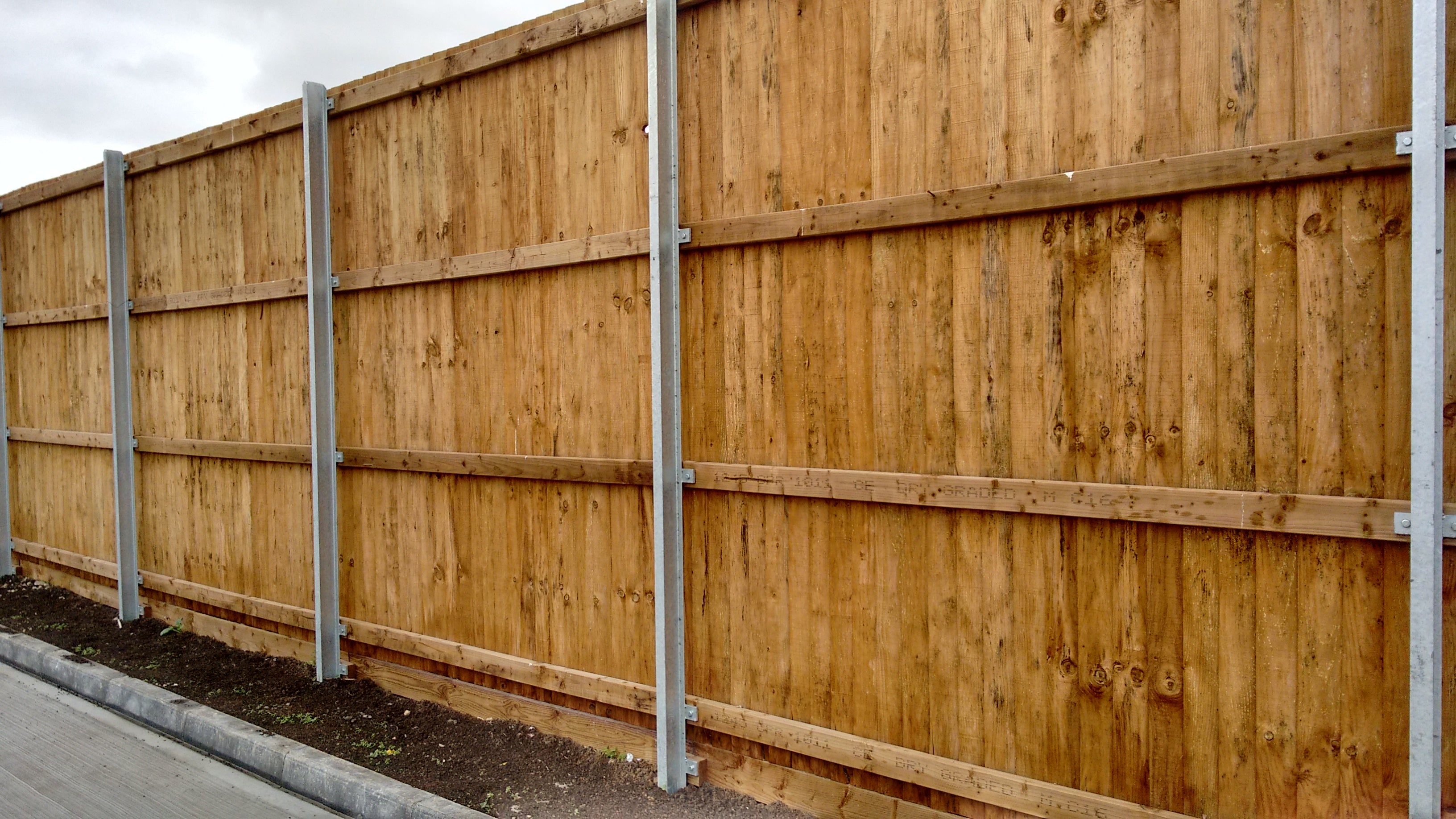 Timber acoustic fence installation at urban setting