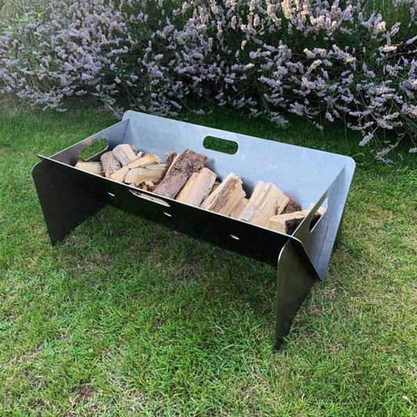 A sleek, contemporary Portable Fire Pit made from hot rolled 3mm mild steel. Features handles for easy transportation and a raised design to prevent ground burns. Ideal for outdoor gatherings and cozy evenings under the stars.